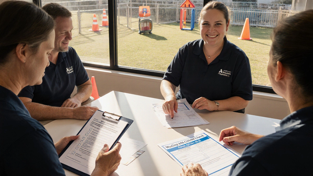 Volunteer team reviewing paperwork in a bright community centre room with safety equipment.